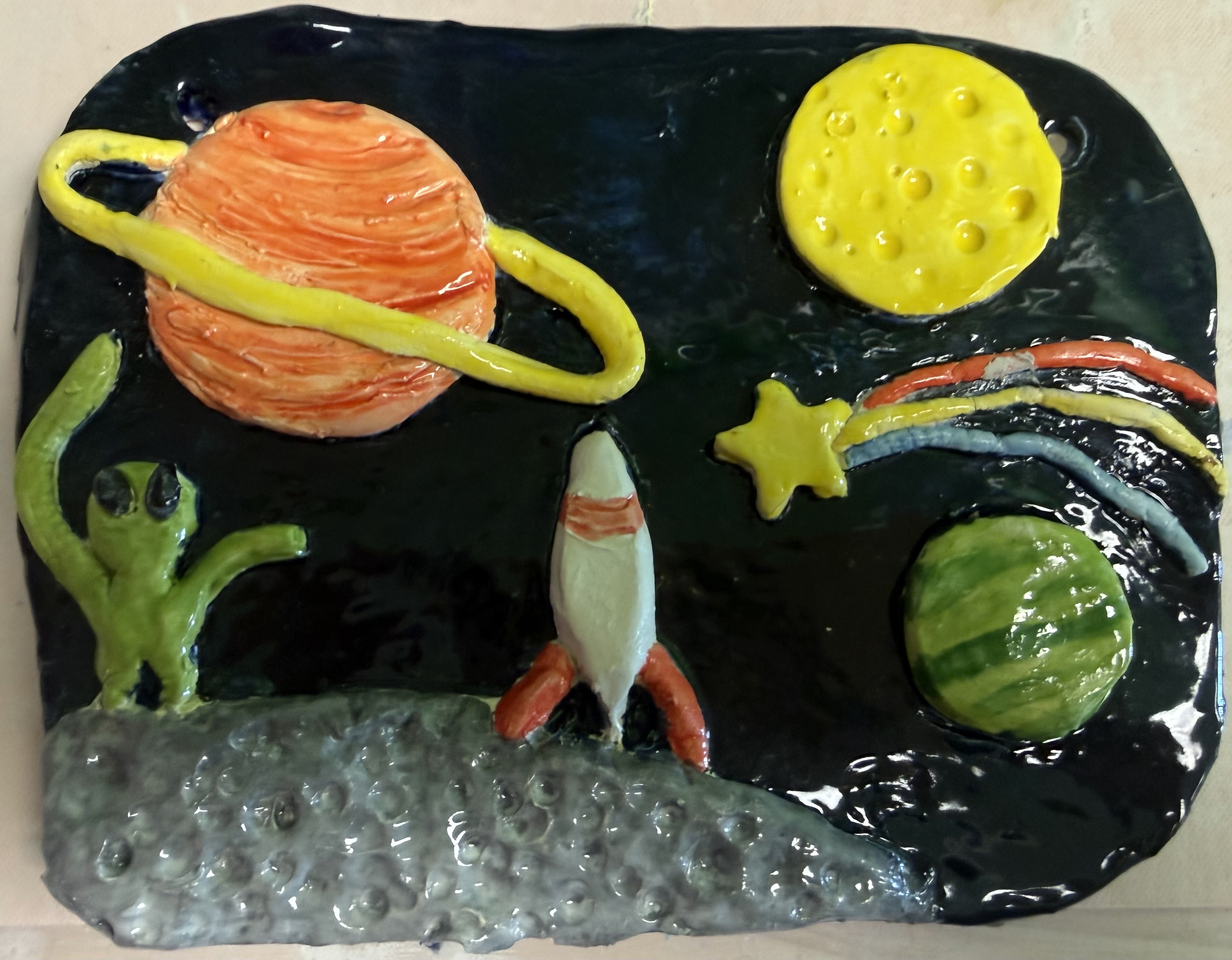 A clay space landscape made at a studio party